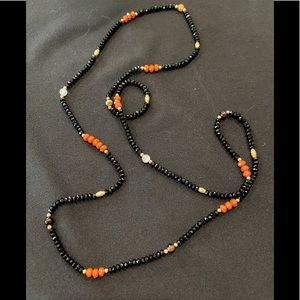 Very reflective gorgeous black necklace with semi precious stones.
